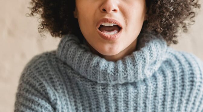 angry black woman pointing at camera